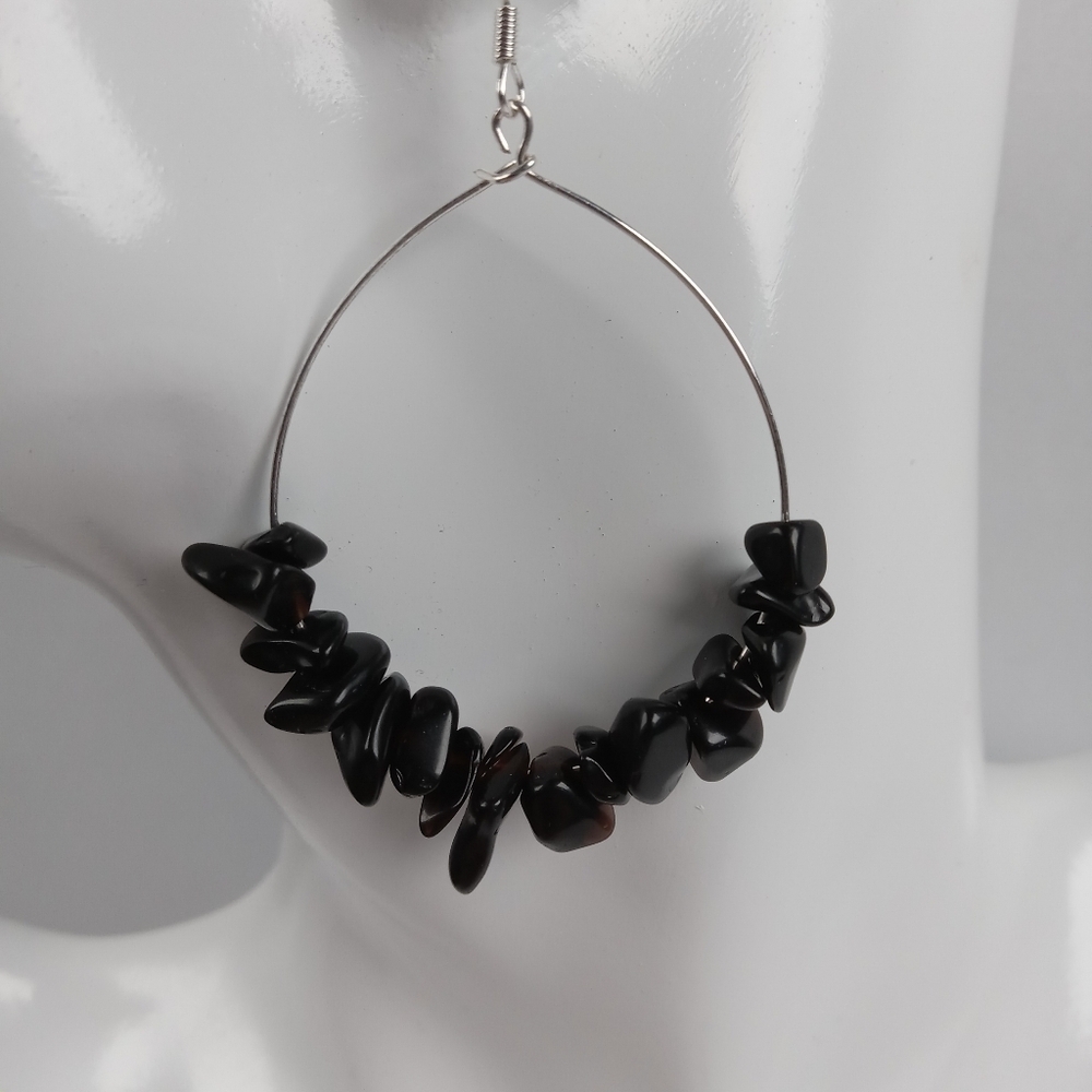 Obsidian stone chips on exposed hoops